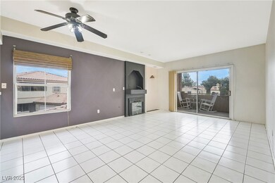 Unfurnished living room featuring tile patterned f