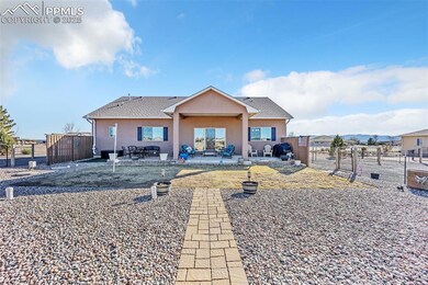 Back of house featuring a patio area, stucco sidin