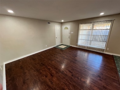 Entryway featuring recessed lighting and dark wood-style floors