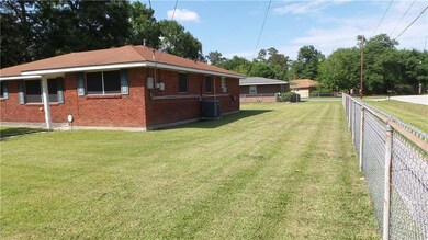 SIDE OF YARD WITH CHAIN LINK FENCING