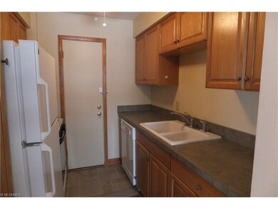 The efficient, galley kitchen has been updated wit