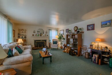 The peaceful, formal living room also has a wood-b