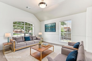 Living room with carpet flooring and vaulted ceil