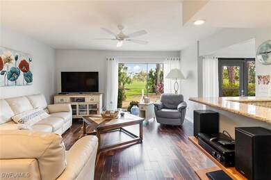 Living room with ceiling fan, a healthy amount of