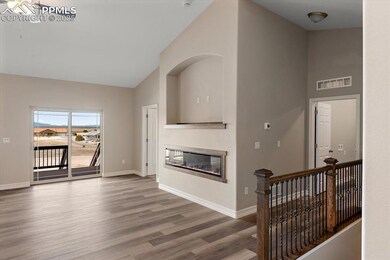 Living area with visible vents, a glass covered fi