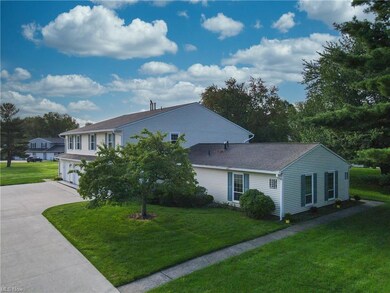 View of front of house with garage and a front law