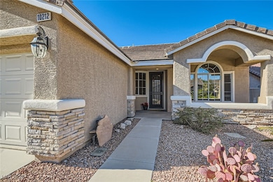 Property entrance with stucco siding and an attach