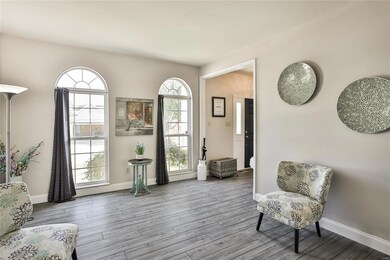 spacious living room or study area with gorgeous windows
