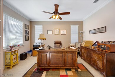 Tiled office with ceiling fan and ornamental moldi