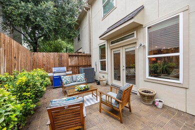 Outdoor space continues to backyard patio. A littl
