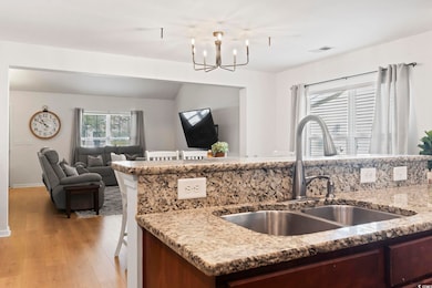 Kitchen featuring sink, light hardwood / wood-styl