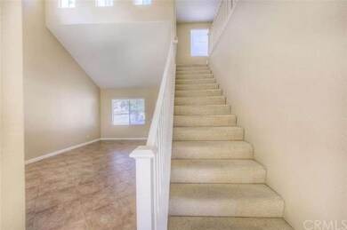 Elegant banister and carpeted stairs leading to be