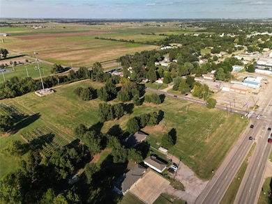 Aerial overview of property's location featuring rural landscape and abundant farmland