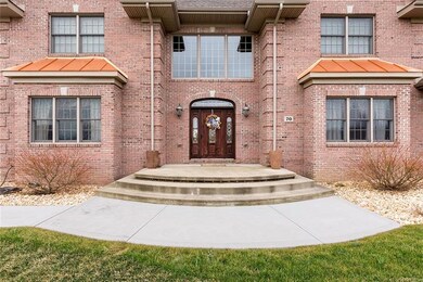 Wonderful Front Porch Approach to this Executive Home.  Don't Miss the Copper Roof Accents!
