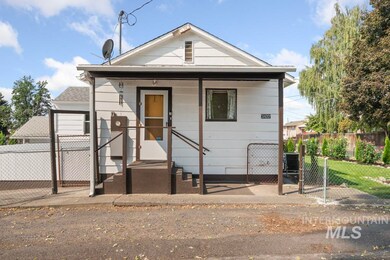 View of front of home featuring a gate