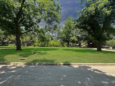 View of home's community with a lawn and view of 