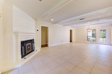 Spacious family room featuring a gas fireplace, timsless mantel, and recessed lighting.