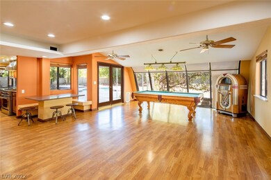 View of pool table which goes with the home
