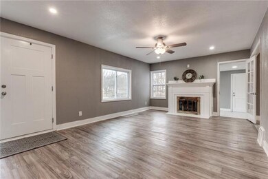 Family room! New flooring and windows throughout h