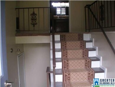 Welcoming entry. Notice the iron banisters