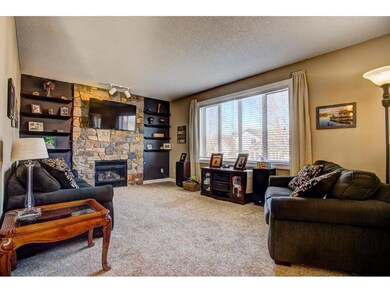 The open sunken living room features a gorgeous st