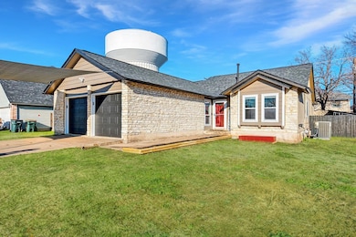 View of front of property featuring stone siding,