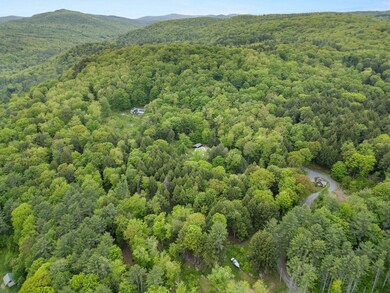 Aerial view of the three properties privately situated on the 33.49 Acres
