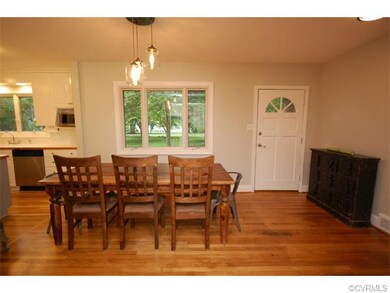 Open floor plan dining room adjacent to the kitche