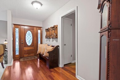 Open Foyer with a beautiful wooden door entrance a