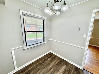 Unfurnished dining area with ornamental molding, d