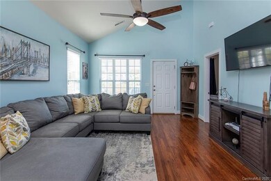 Large living area with vaulted ceiling.