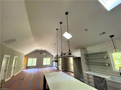 This home is the ultimate open concept design.  The soaring ceilings and skylights make an expansive bright and cheery environment.