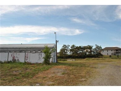 Parking Lot/Garage. Huge pole building, concrete f