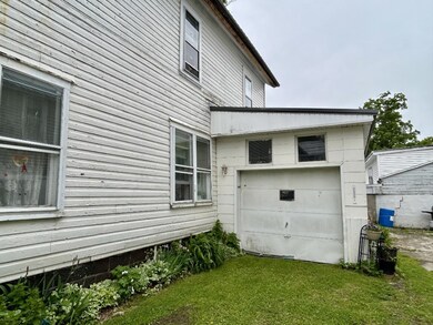One car garage is attached to first floor home