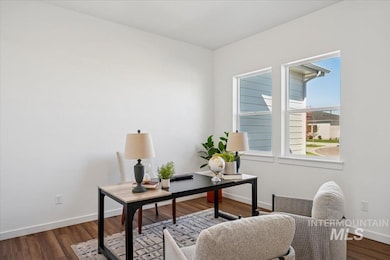 Office featuring baseboards and dark wood-style flooring