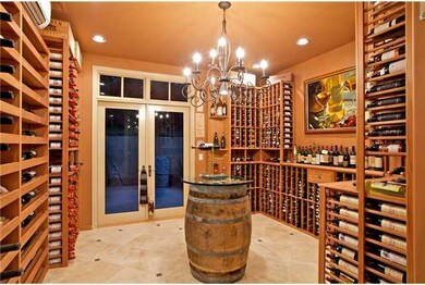 your entertaining starts at this custom, 2000 bottle wine room just off the kitchen and family room, convenient to the living and dining rooms, with an open flow to the beautiful yard.