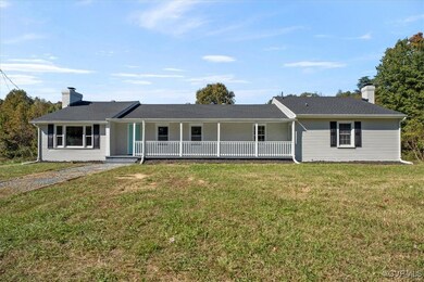 Ranch-style home with a front yard and covered por