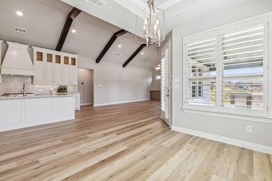 Unfurnished living room featuring lofted ceiling w