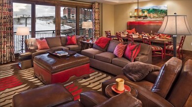 Great room with fireplace and balcony