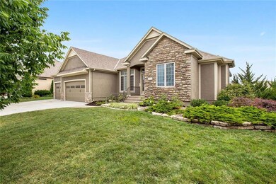 Side view of home. Landscape sweeps around home to