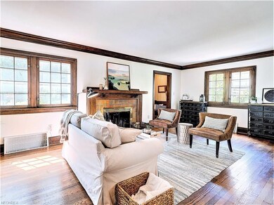 * LIVING ROOM WITH WOODBURNING FIREPLACE AND DOUBL