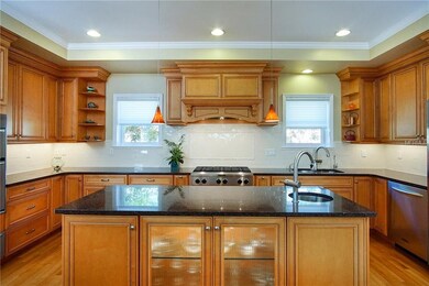 Gorgeous custom kitchen with center island and man