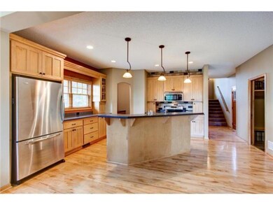 Stunning Kitchen features gleaming hardwood floors