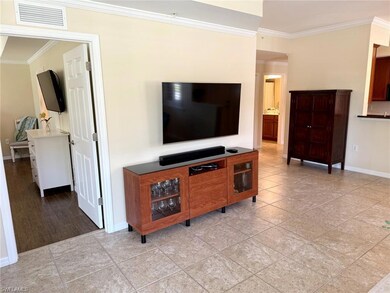 Living area featuring light tile patterned floors 