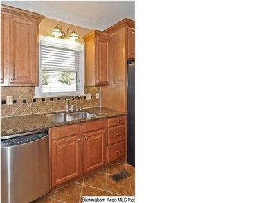 Kitchen has stainless appliances, and custom cabin