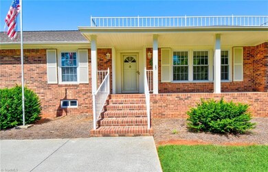 Covered front porch ideal for watching the neighborhood walkers go by.