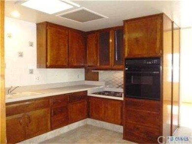 Kitchen view Toward Built-in Oven and Stove-top