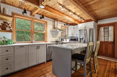 Kitchen featuring a center island, appliances with