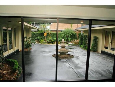 Exterior Back. Professionally landscaped, koi pond