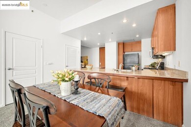 Dining room with recessed lighting and light carpet